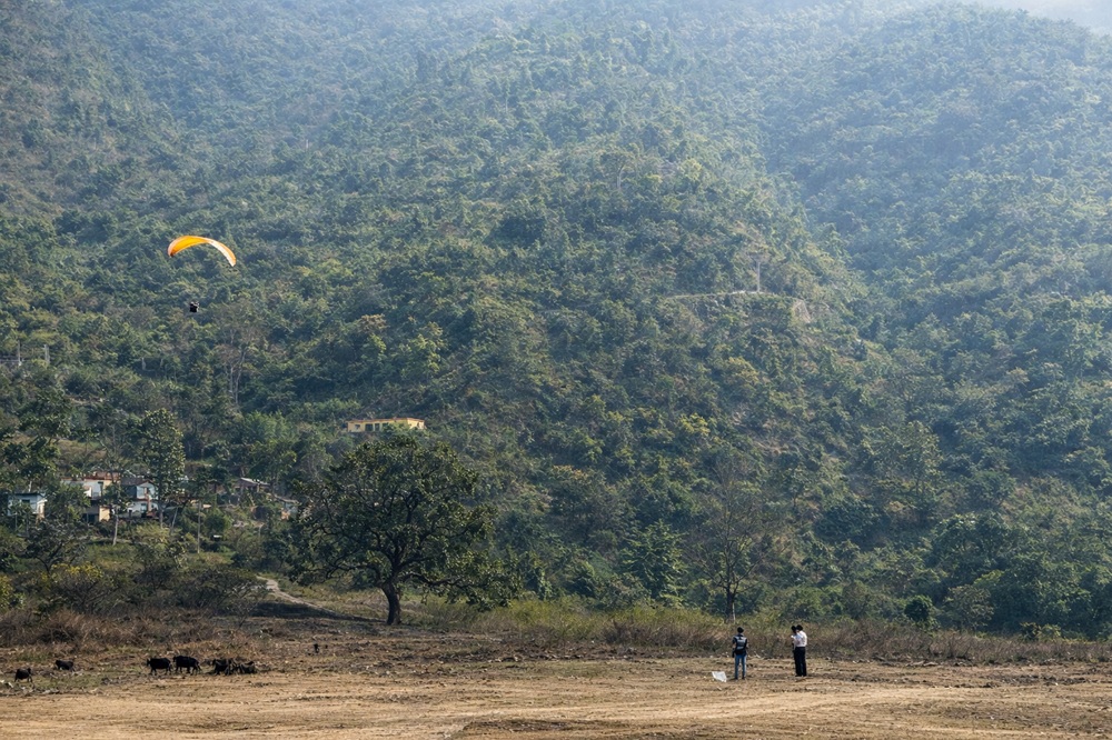 Paragliding over the valley landscape
