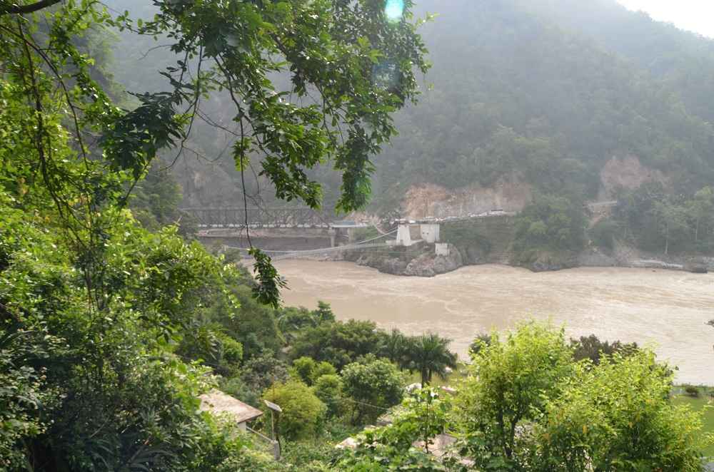 Acess to Our Campiste by walking up crossing the hanging bridge on the Ganges & Mala village