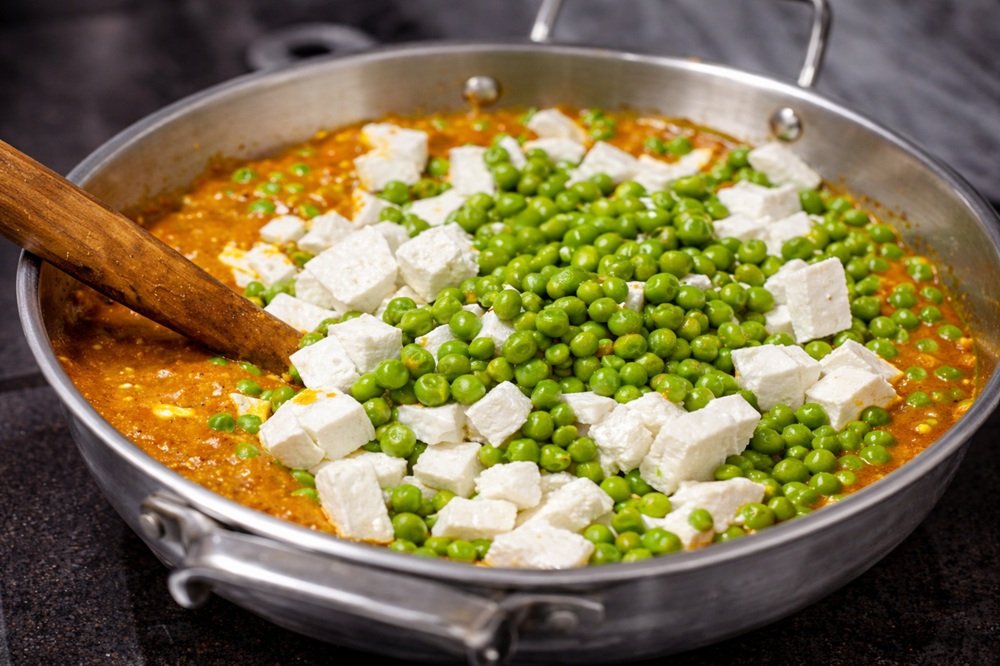 Traditional Indian matar paneer curry prepared during the cooking class