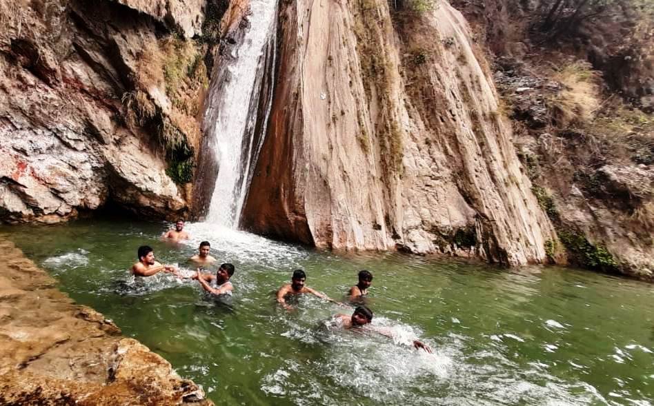 Neer Waterfall surrounded by the green Himalayan foothills