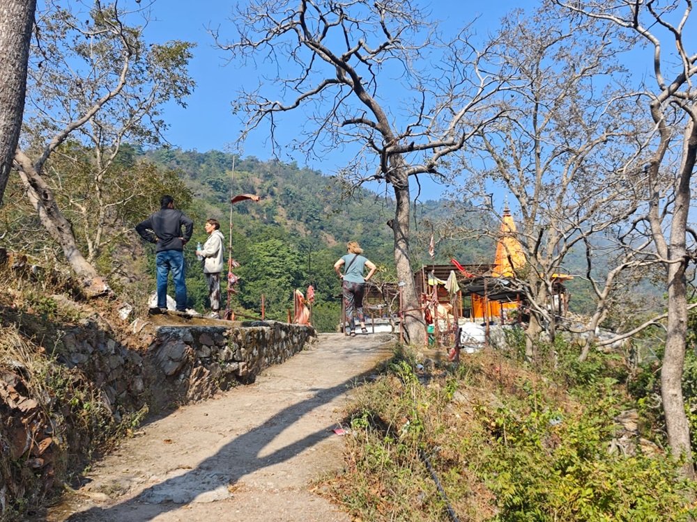 Hilltop temple viewpoint surrounded by Himalayan greenery